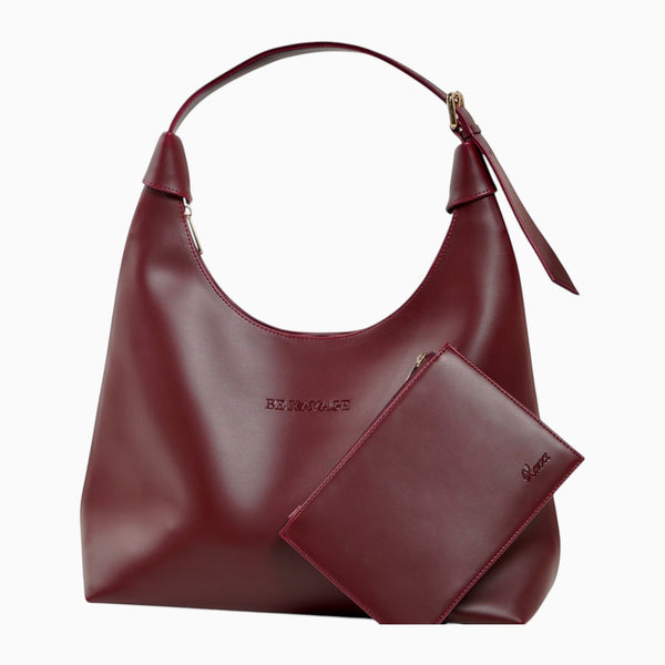 Bolso Xava BE XAVAGE color burdeos con silueta minimalista y cartuchera a juego incluida para mujer