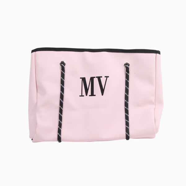 Bolso grande Xava rosa de material sintético con iniciales bordadas y tirantes con patrón gráfico